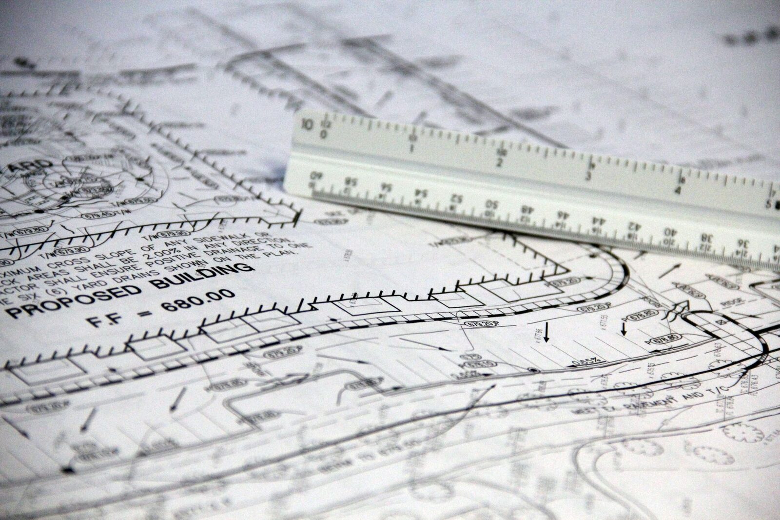 Drawings and scale ruler used to verify completed work