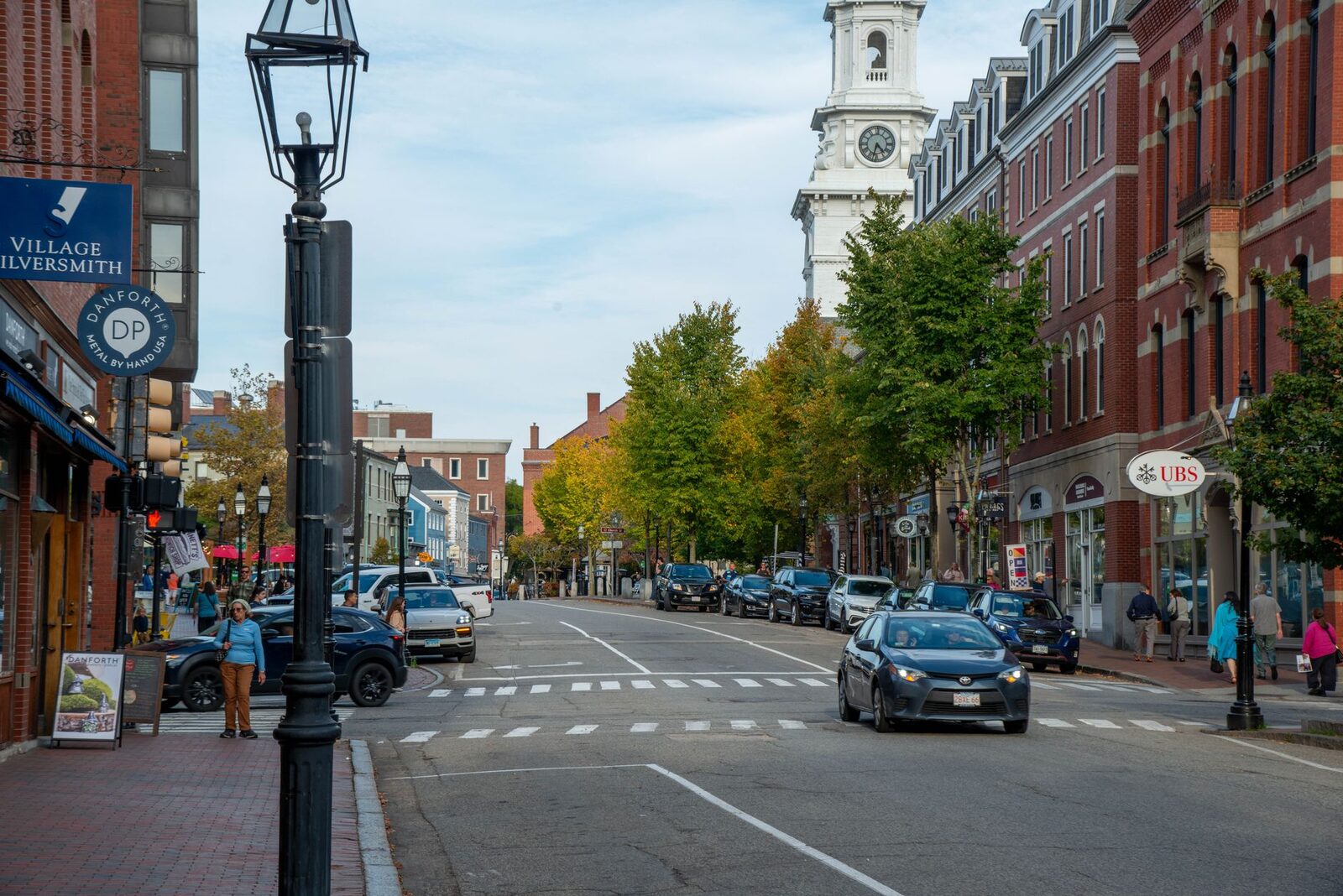 New England downtown street lined with commercial storefronts