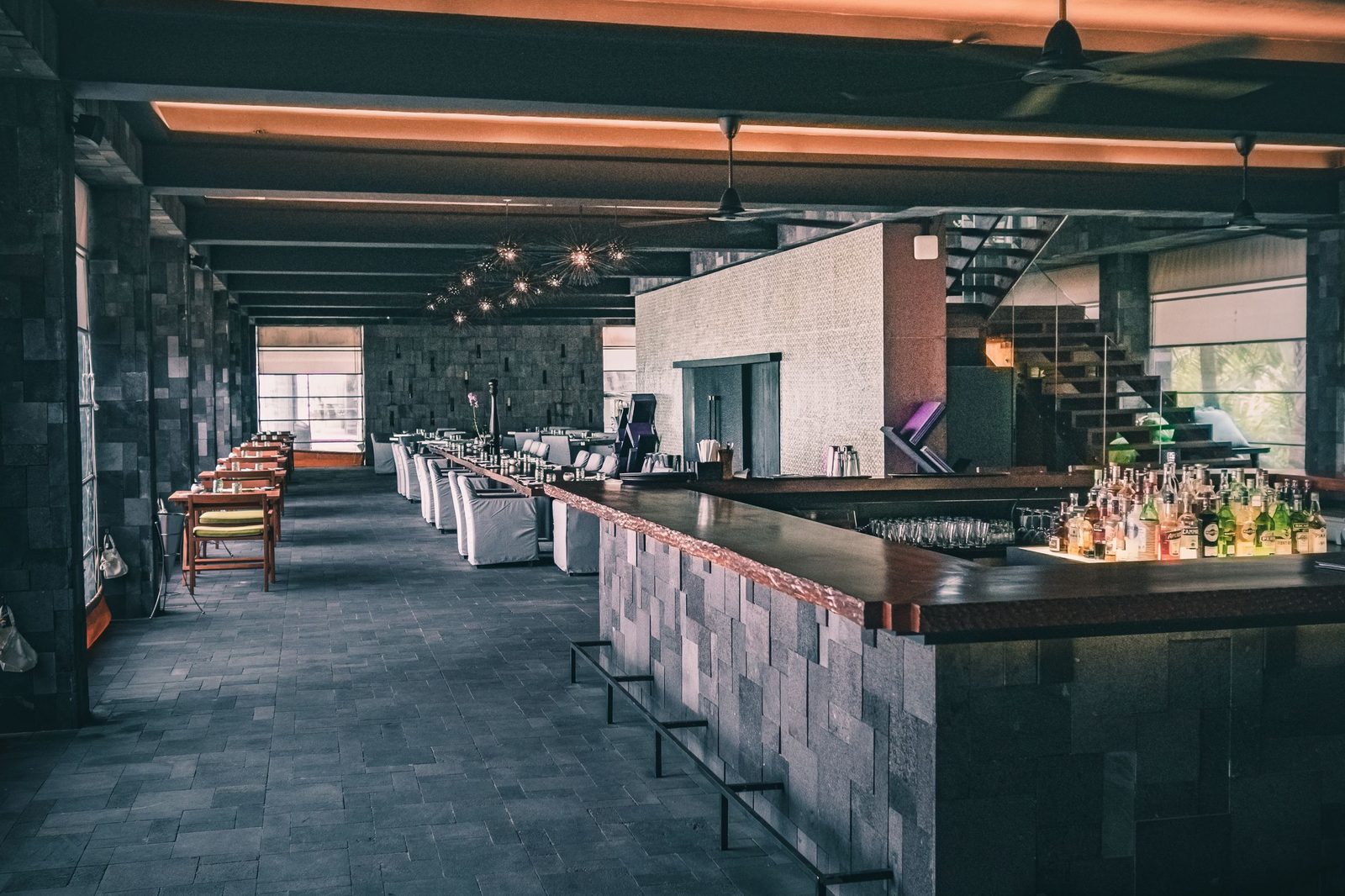 Finished commercial restaurant interior with a full-length bar, ready for service
