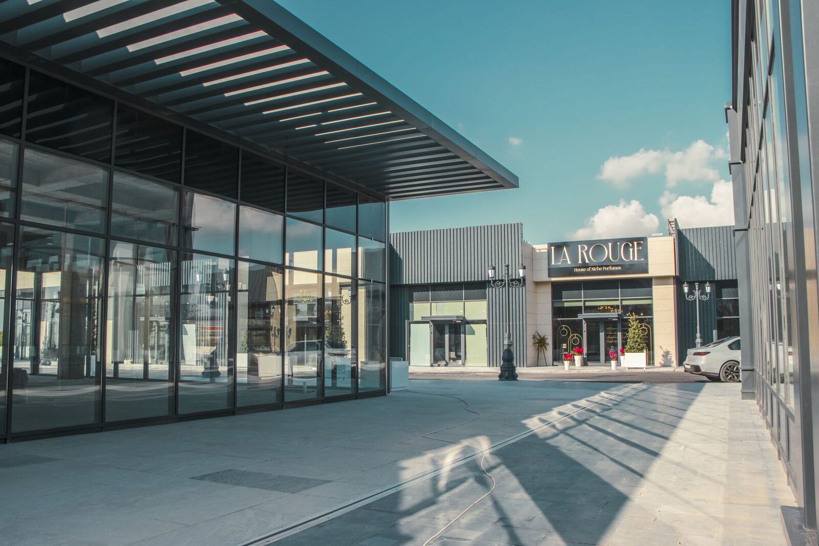 Modern retail arcade with glass storefronts